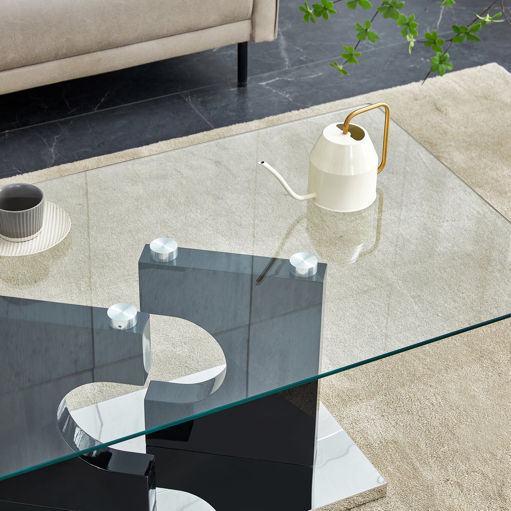 A rectangular modern and fashionable coffee table with tempered glass tabletop and black MDF legs. Suitable for living room.47.2"*25.5"*18"
