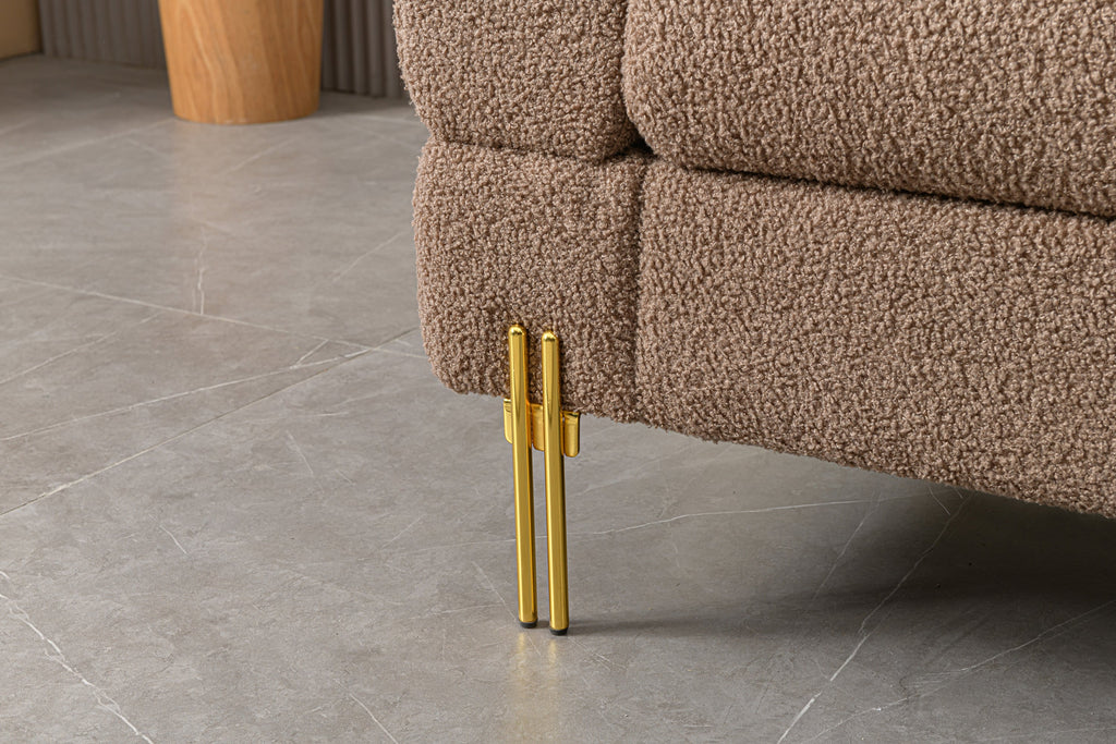 Luxurious and comfortable upholstered sofa with golden legs and pillows for living room and reception area