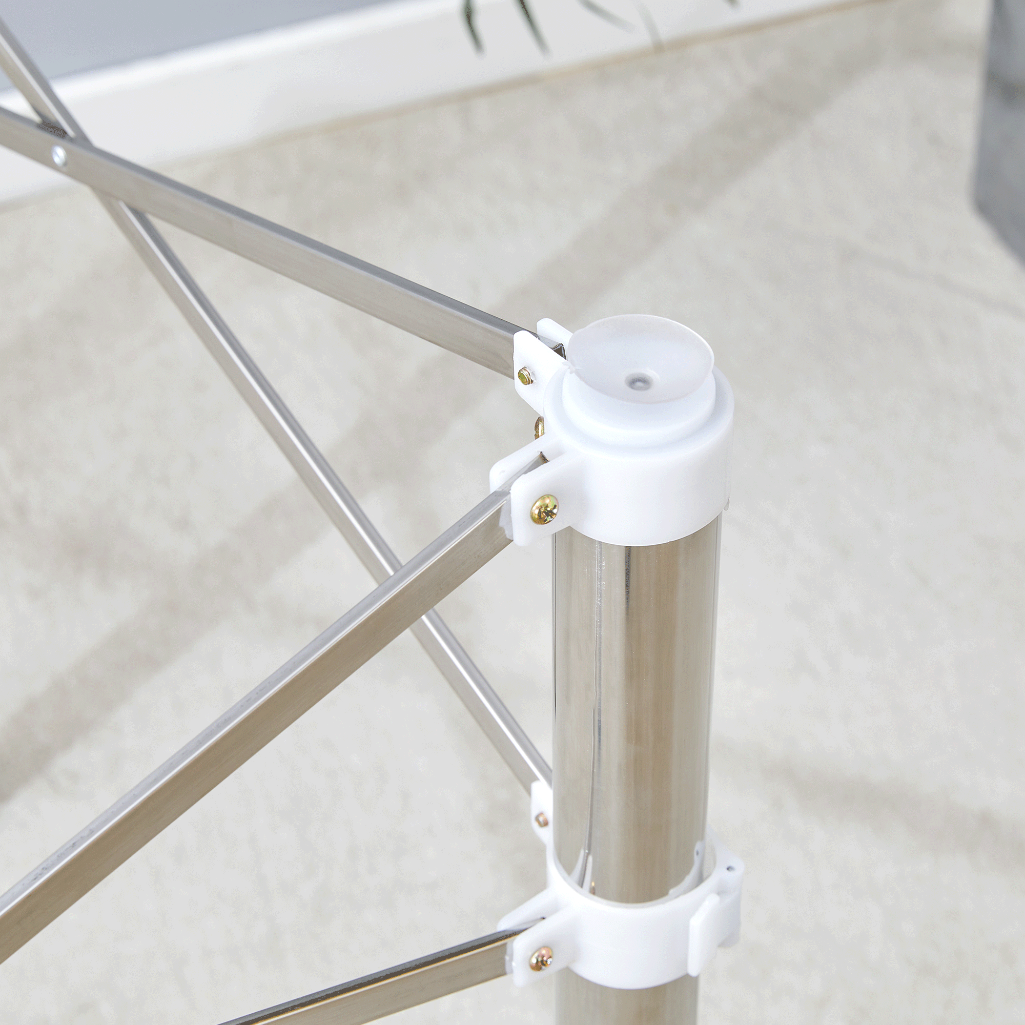 Elegant Expandable Square Glass Table - 36' Clear Tempered Glass, Silver Metal Legs.Telescopic metal legs, transparent square glass tabletop, suction cup attachment connection.