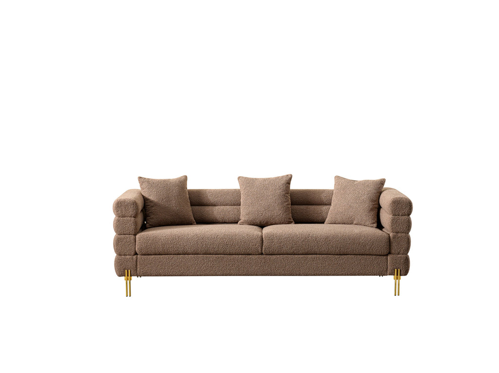 Luxurious and comfortable upholstered sofa with golden legs and pillows for living room and reception area