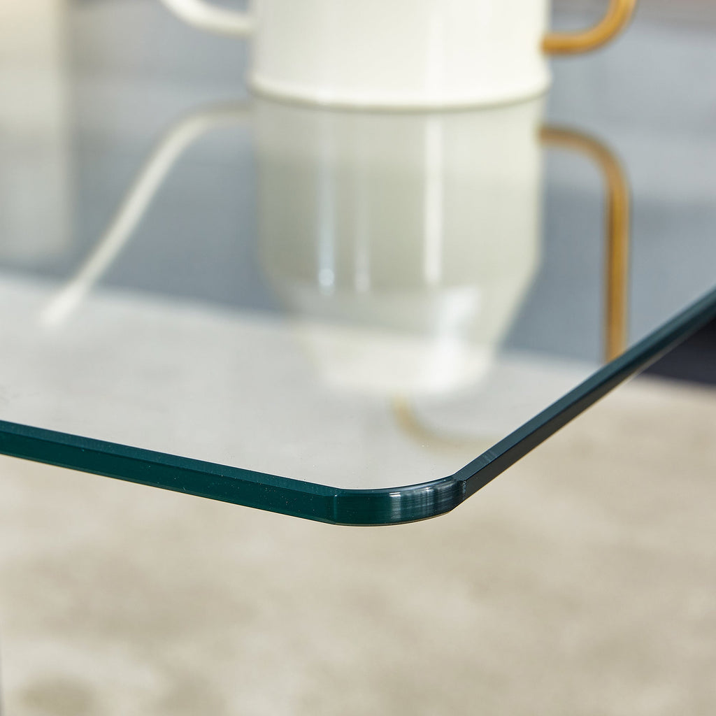 A rectangular modern and fashionable coffee table with tempered glass tabletop and black MDF legs. Suitable for living room.47.2"*25.5"*18"