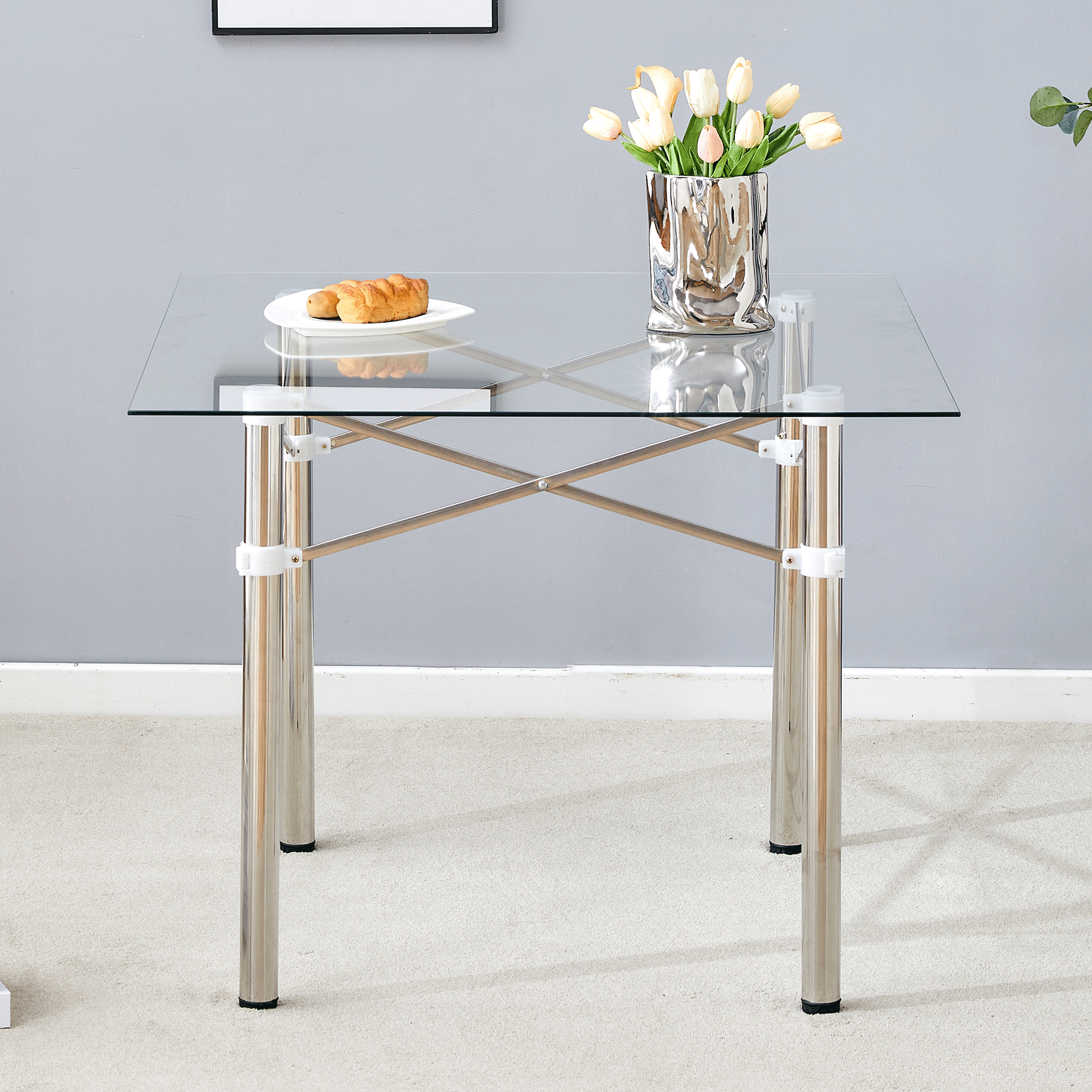 Elegant Expandable Square Glass Table - 36' Clear Tempered Glass, Silver Metal Legs.Telescopic metal legs, transparent square glass tabletop, suction cup attachment connection.