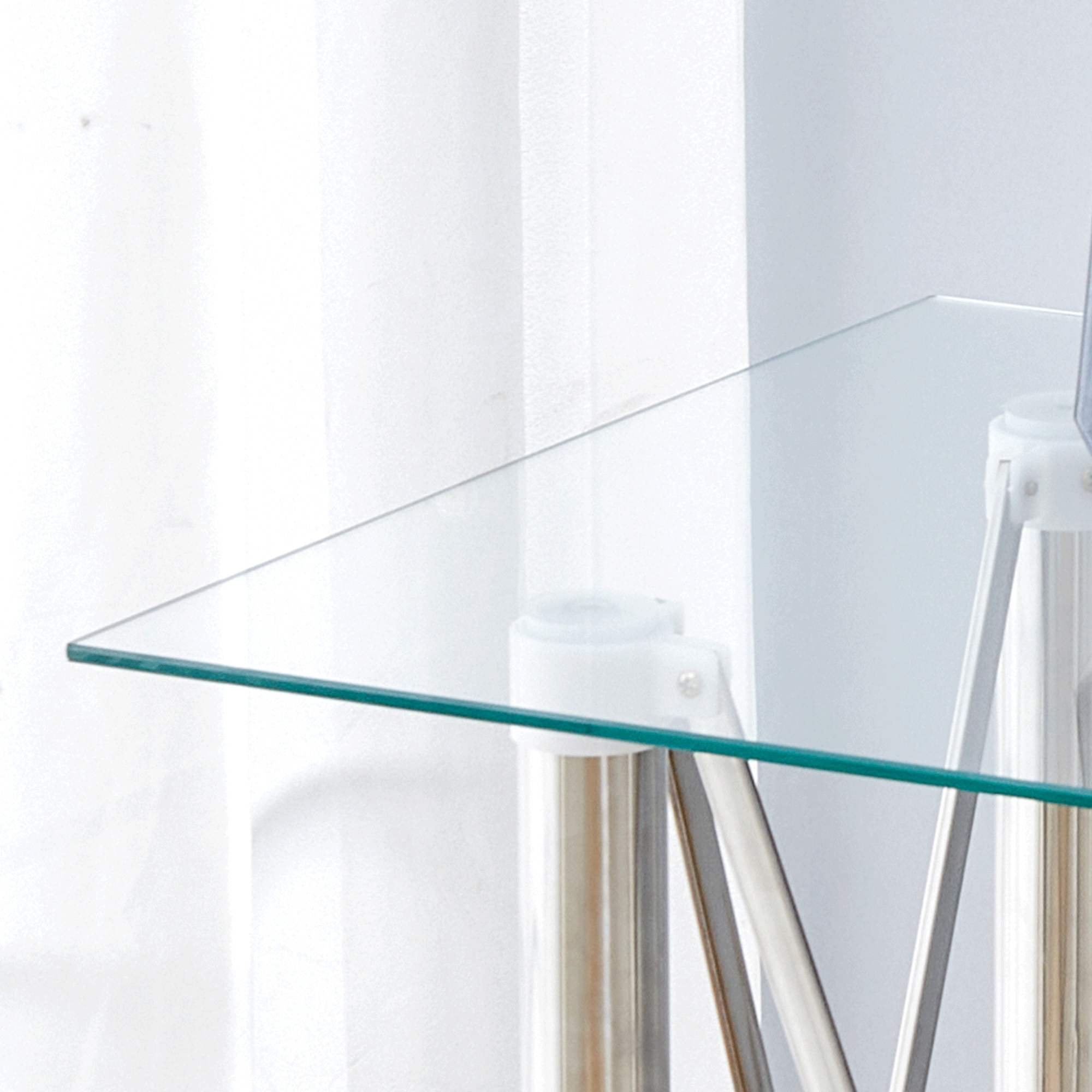 Elegant Expandable Square Glass Table - 36' Clear Tempered Glass, Silver Metal Legs.Telescopic metal legs, transparent square glass tabletop, suction cup attachment connection.