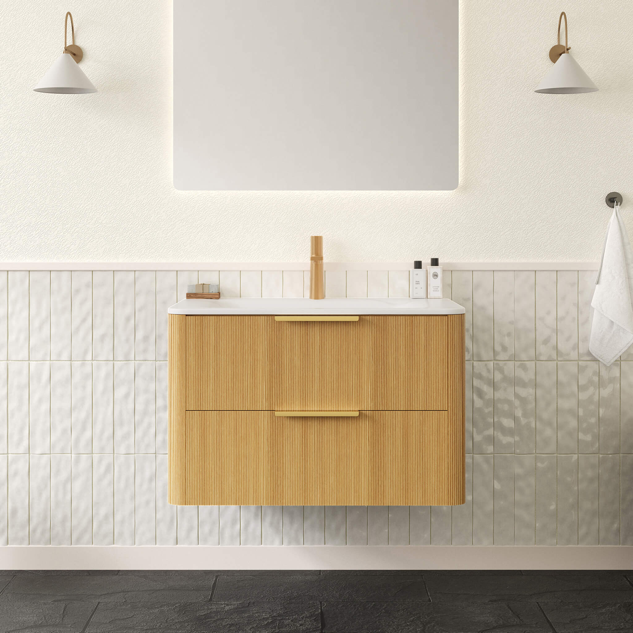 Bathroom vanity with wooden cabinet, white countertop, and mirror above in a tiled bathroom.