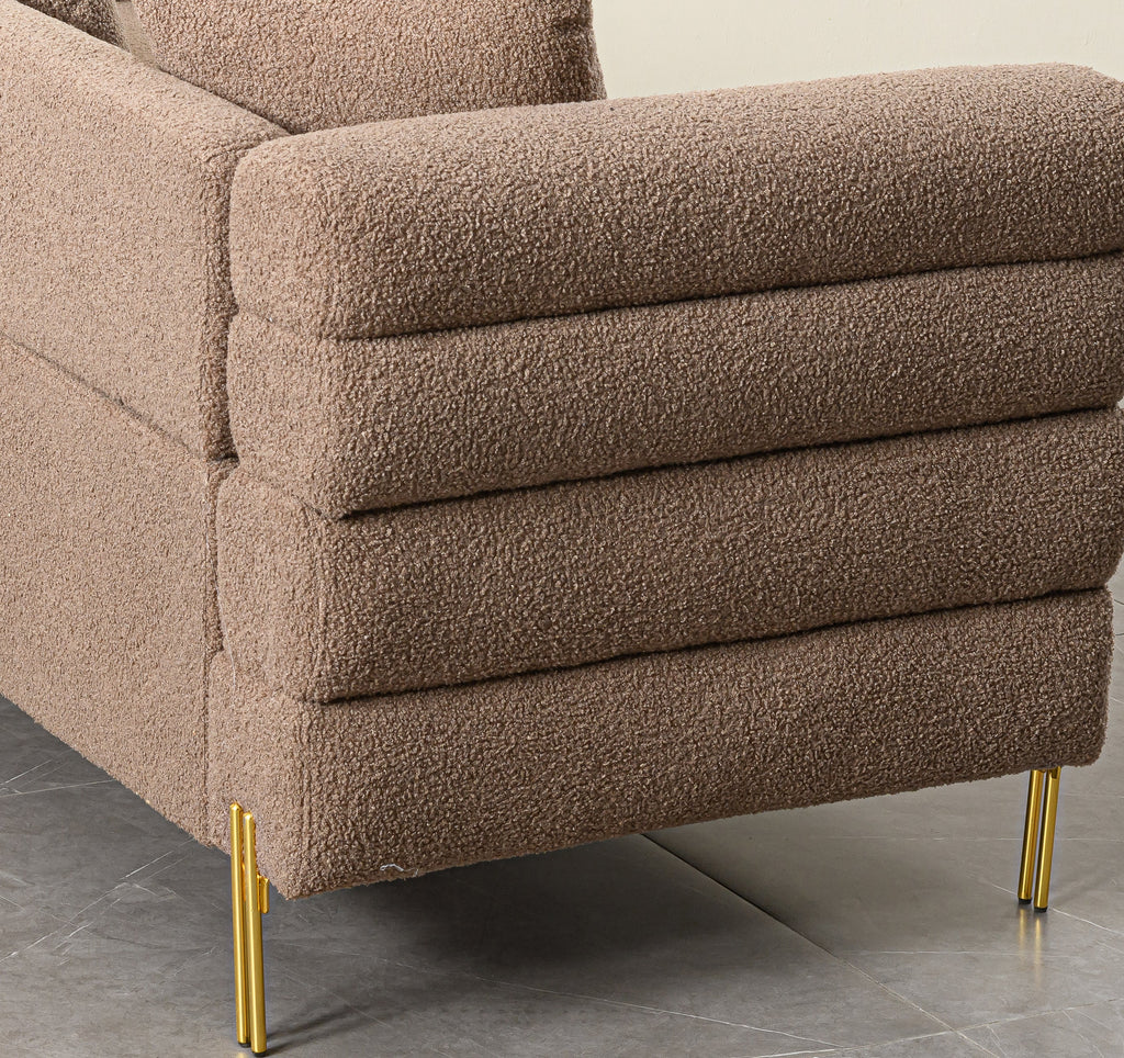 Luxurious and comfortable upholstered sofa with golden legs and pillows for living room and reception area
